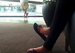 Candid Great feet in flip flops at mall