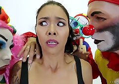 Cheeky and crazy tattooed lady fucked at the same time with three clowns.