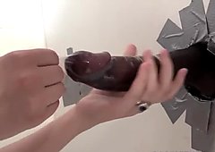 Naughty blonde discovers a huge black cock at the gloryhole